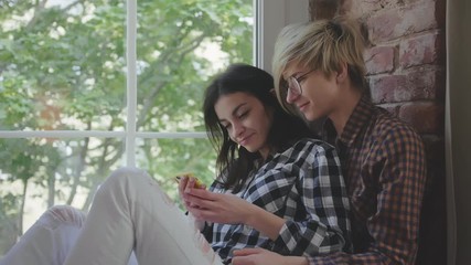 Lesbian couple spending nice time at home.
