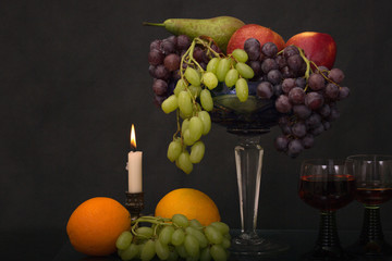 fruits in an old vase and wine
