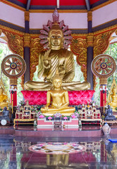 Large golden Buddha statue with the small Buddha statue are all around.