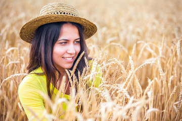 portrait of the rural girl in a straw hat