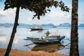 Small bangka boats on Corong Corong beach, El Nido, Philippines
