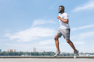 Afro Guy Running Working Out Near River In City
