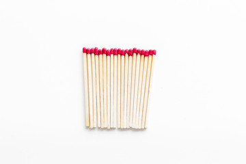 Symbol of danger with matches on white background top view
