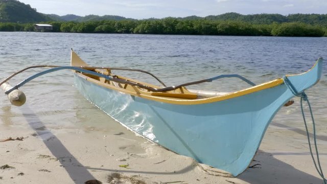 Long boat floating on shoreline beautiful blue tropical island seascape. Siargo, Philippines.