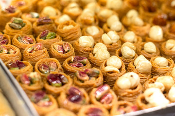 Traditional delicious turkish desserts in the shop window showcase. Different kinds of turkish delights. Popular souvenirs and snacks from Turkey.