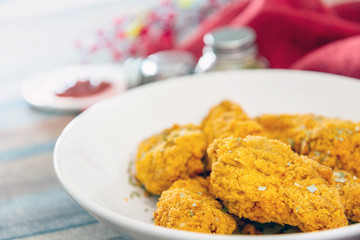 Chicken Wings Spicy chicken wings, breaded, fried, cooked.