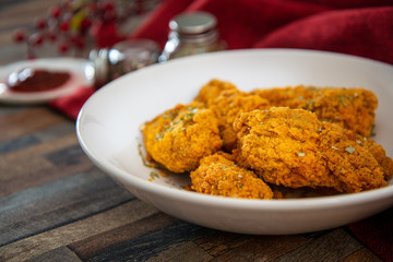 Chicken Wings Spicy chicken wings, breaded, fried, cooked.