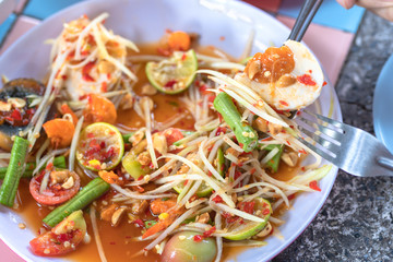 Papaya salad or what we called in Thai Som Tum the popular Thai style local the eastern delicious food of Thailand