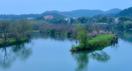 Wuyuan, March 22, 2018: fishermen in Moon Bay, Wuyuan, Jiangxi, China