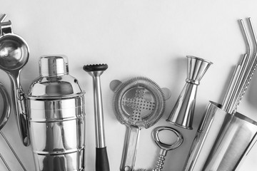 Accessories for making cocktails ,shaker, glass, jigger, straws, filter, scoop, spoon bar , mudler, geyser, strainer on white background