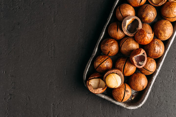 Macadamia nuts on a dark background