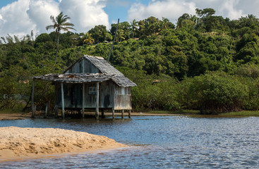 Fisehrman shed over the water