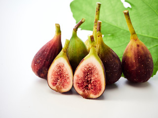 Figs fruit with leaves on white background