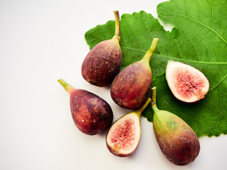 Figs fruit with leaves on white background