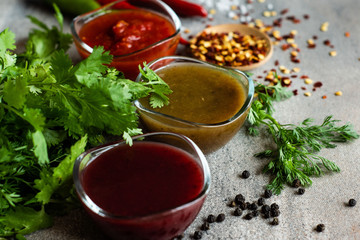 Georgian sauces on stone background