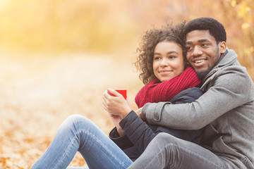 Naklejka premium Young couple in love spending time together at park