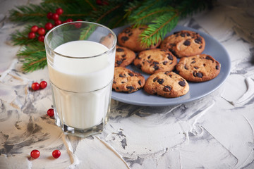 milk and cookies for Santa. holidays, celebration and home concept