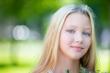 Portrait of a beautiful teenage girl. Ten year old blue-eyed girl