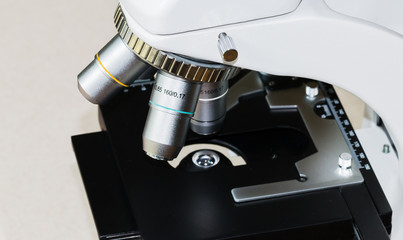 Close up look at a microscope and the lenses.