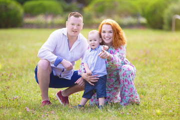 Fototapeta premium Happy family with son in the park