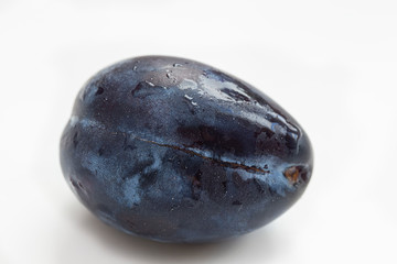 Plum close up on white background