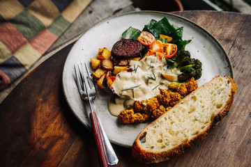 Warm hearty breakfast, lunch with organic farm curry veggies. Wood table. Slow food living concept, close up, food photography from above