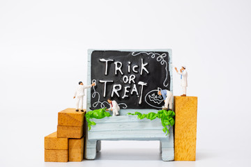 Miniature people coloring Halloween Party Props Decoration on a white background , Halloween party concept