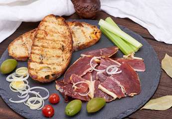 pieces of jamon and white fried bread for a sandwich
