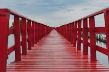 Obraz premium Beautiful red long bridge at seaside samut sakhon province Thailand which dolphin view point.