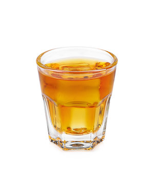 Glass of scotch whiskey and ice on  white background