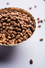 Indian charoly / Buchanania lanzan / Almondette kernel seeds in a bowl or pile. selective focus