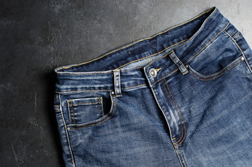 Denim. Blue jeans on black background. Close up