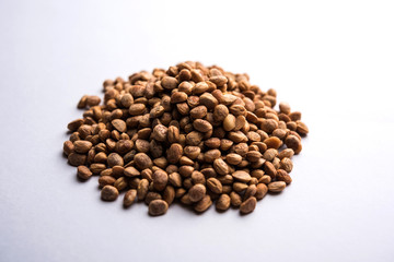 Indian charoly / Buchanania lanzan / Almondette kernel seeds in a bowl or pile. selective focus