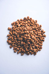 Indian charoly / Buchanania lanzan / Almondette kernel seeds in a bowl or pile. selective focus