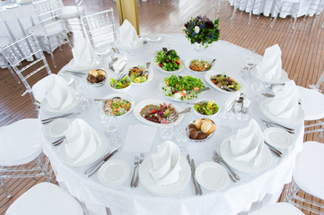 white table with snacks, top view