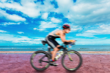Fototapeta na wymiar Cycling triathlon at beach