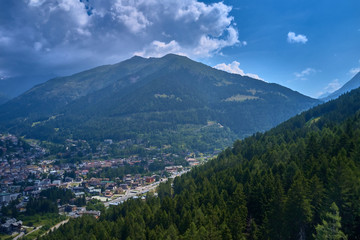 Fototapeta premium Panoramic view of the Ponte di Legno region of Trento the north of Italy. The popular ski resort town of Ponte di Legno. Summer time of the year. Aerial view. Photo taken on a drone.