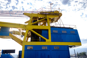 Fragment of a ship crane for loading unloading containers.