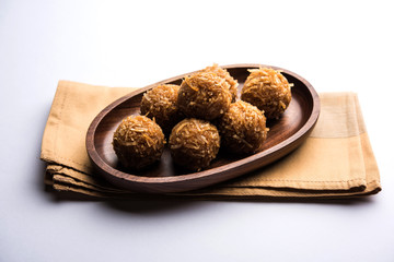 Jaggery coconut Laddoo / Nariyal gur ke laddu, indian sweet food for festivals like rakshabandhan/rakhi pournima