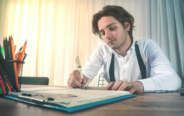 young business man is signing the deal