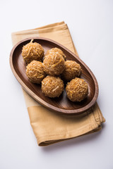 Jaggery coconut Laddoo / Nariyal gur ke laddu, indian sweet food for festivals like rakshabandhan/rakhi pournima