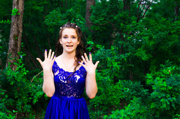 beautiful girl in long dress in the forest