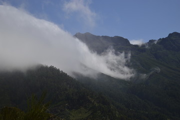 Cloud engulfs mountain