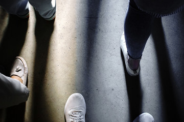 shadow of the feet of people look down © Алексей Филатов
