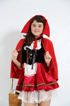little red riding hood with a basket in hand