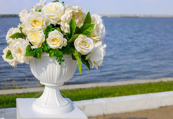 wedding decorations. Roses on the river background