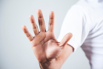man hand stop sign