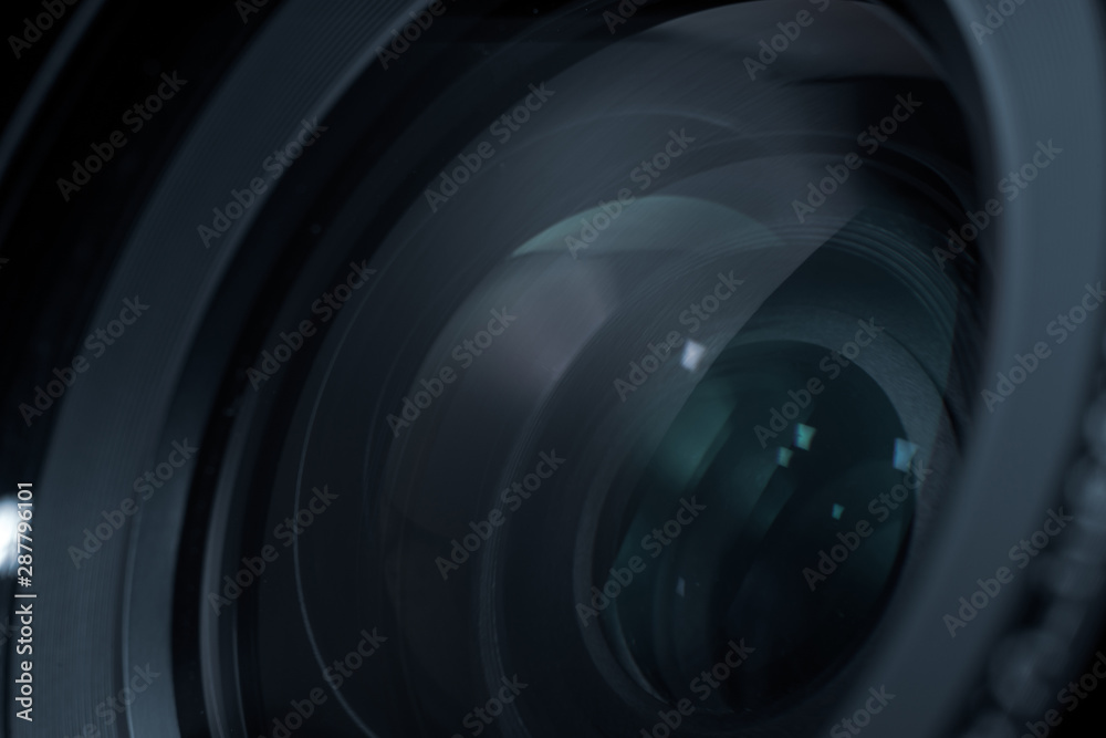 Poster close up beautiful camera lens with color reflection background.