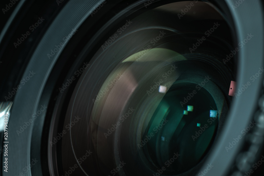 Poster close up beautiful camera lens with color reflection background.