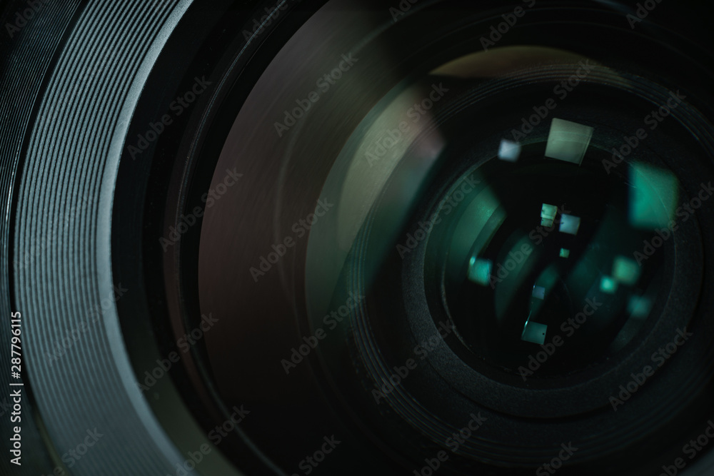 Poster close up beautiful camera lens with color reflection background.